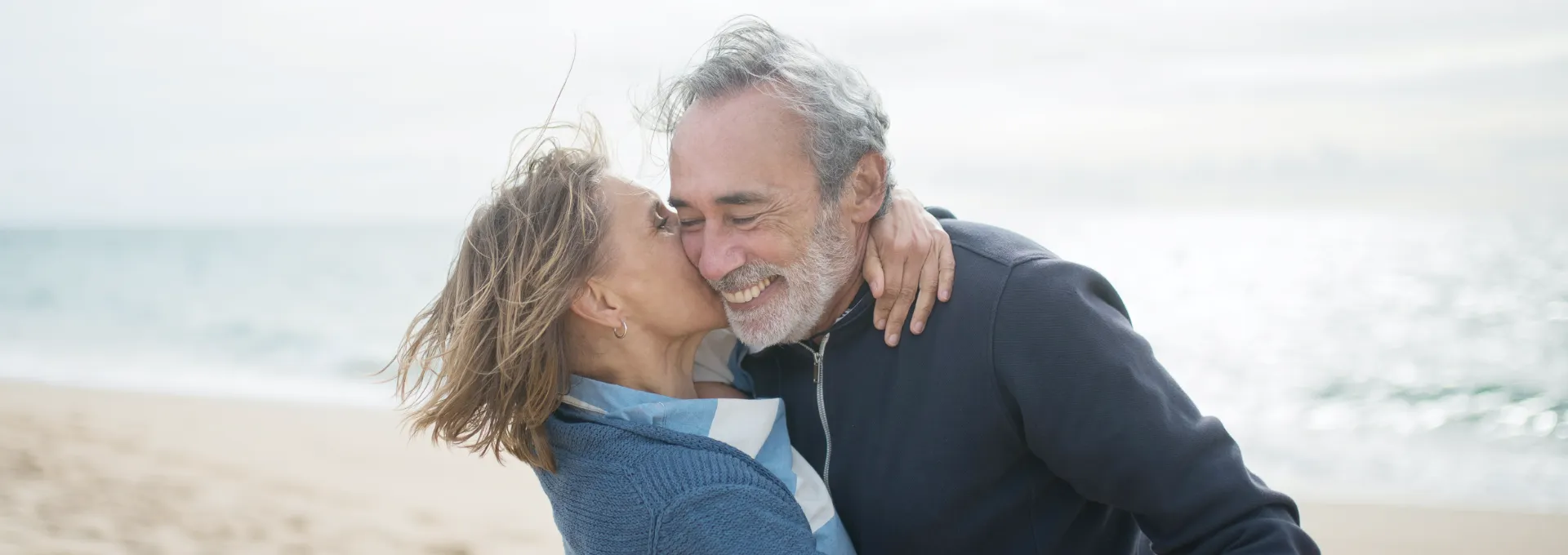 Happy Couple Embracing on the Beach