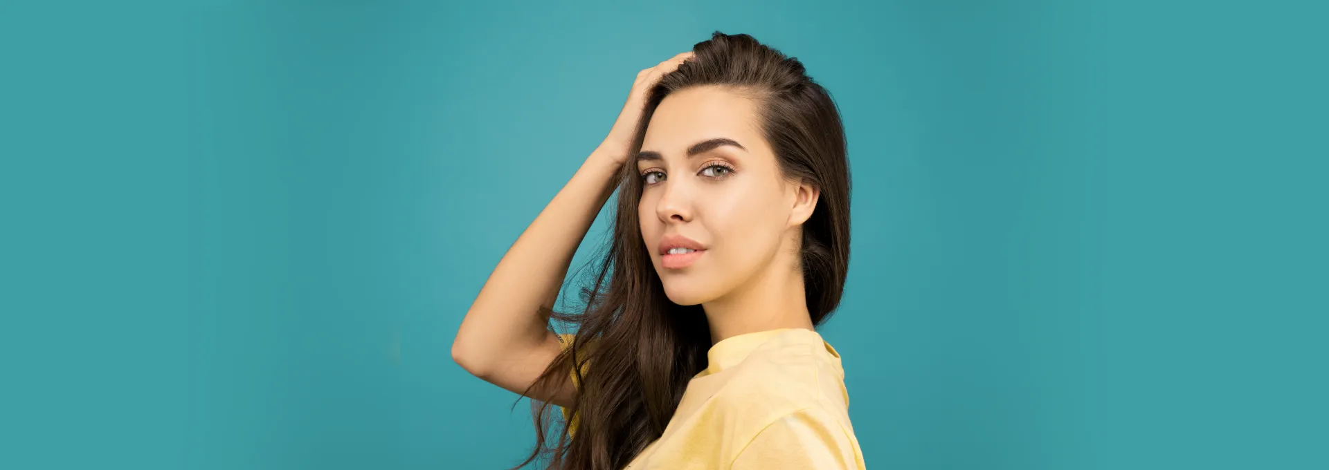 Young woman with youthful lips looking at camera