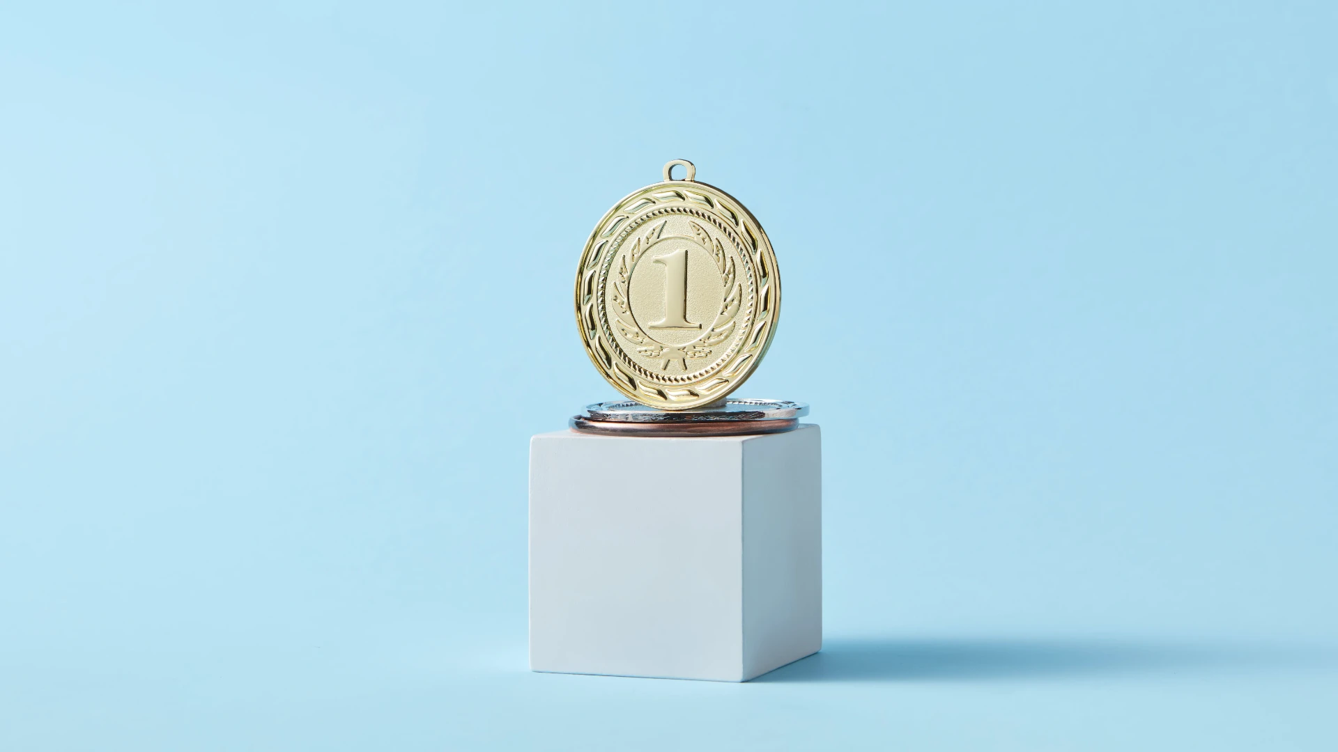 - JOSEPH Advanced Oculofacial Plastic Surgery Photo of Gold Medal on a Pedestal